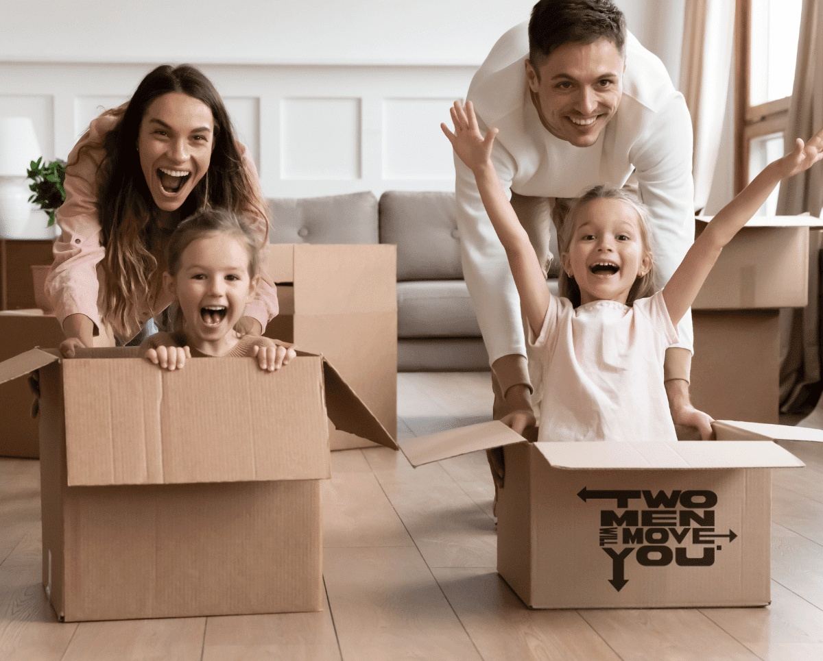 A family unpacking moving boxes printed with the Two Men Will Move You logo